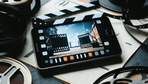 Conceptual image of a smartphone surrounded by film-related icons and tools, illustrating the transformation of mobile devices into powerful video production tools.