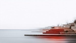 A conceptual photograph illustrating the transformation of photography into art, showcasing dramatic lighting and bold angles that merge architectural elements with natural forms to evoke emotional storytelling.
