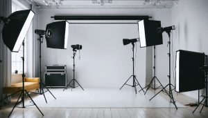 A transformed room showcasing a professional photography studio setup with organized lighting equipment, backdrops, and camera gear, illustrating distinct functional zones.