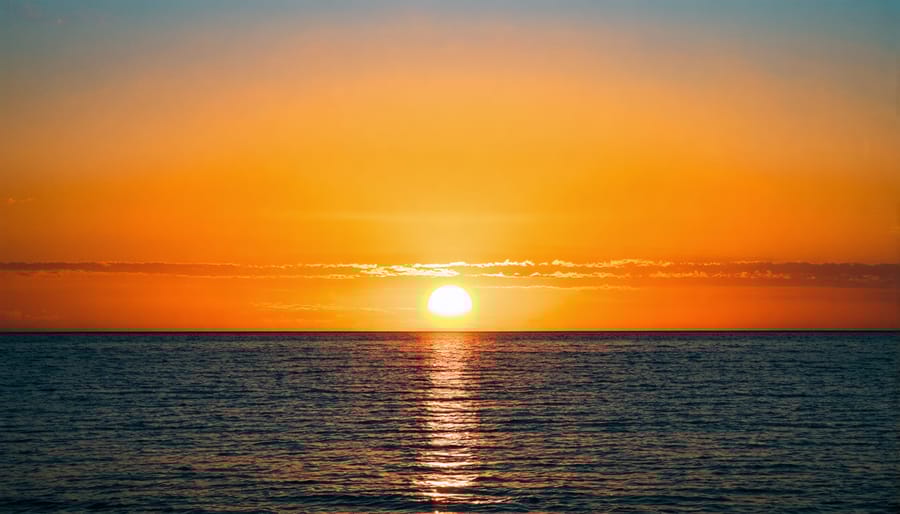 Sunset over water showing complementary color composition in photography