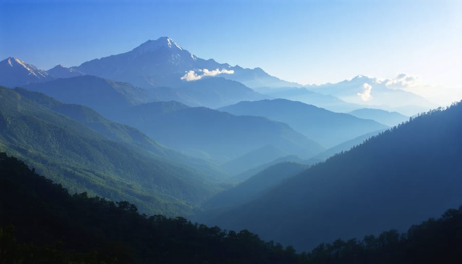 Stunning mountain vista photographed during sunset with golden light illuminating peaks and valleys