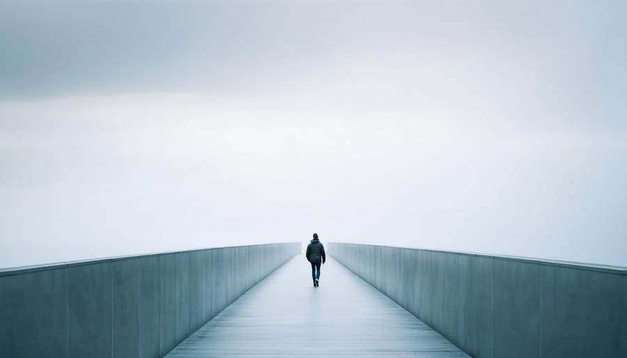 Blurred motion of lone figure walking through an empty urban corridor