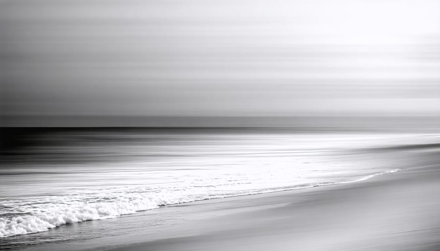 Minimalist black and white seascape with single pier extending into calm water