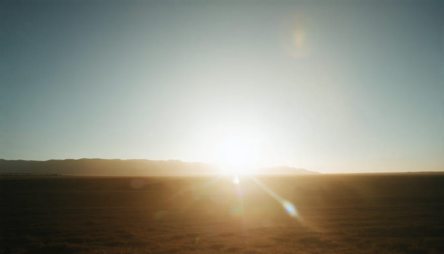 Photographer shooting into golden hour sunlight demonstrating improved lens flare control
